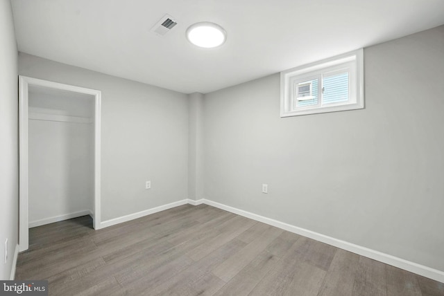 1418 D St, Woodbridge, VA 22191 - unfurnished bedroom with wood finished floors and a closet