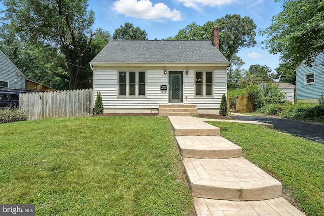 1418 D St, Woodbridge, VA 22191 - view of front facade featuring a chimney and a shingled roof