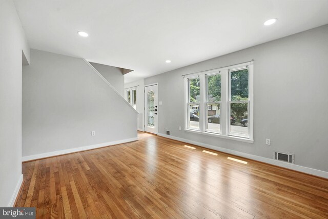 1418 D St, Woodbridge, VA 22191 - unfurnished living room with wood finished floors, stairs, and recessed lighting