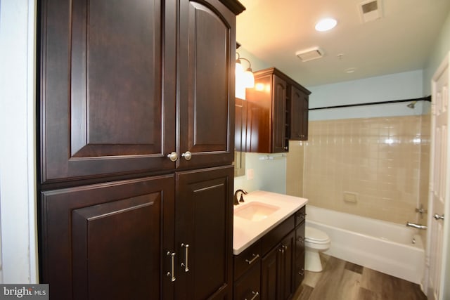 104 Rock Creek Ct, Frederick, MD 21702 - full bathroom with vanity, wood finished floors, and shower / bathtub combination