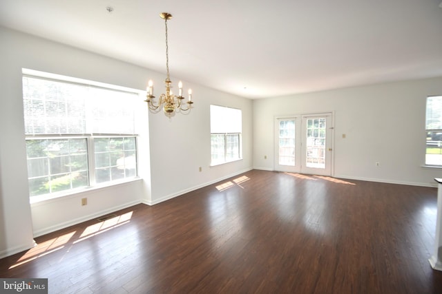104 Rock Creek Ct, Frederick, MD 21702 - spare room featuring a chandelier, wood finished floors, and fire sprinkler in ceiling