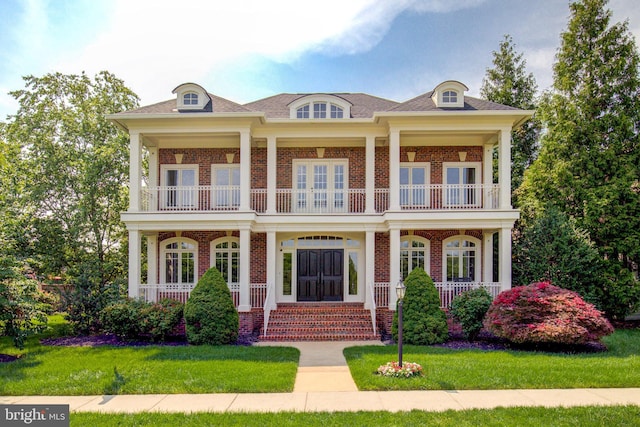 22966 Lois, Brambleton, VA 20148 - view of front of property with a balcony, covered porch, and brick siding