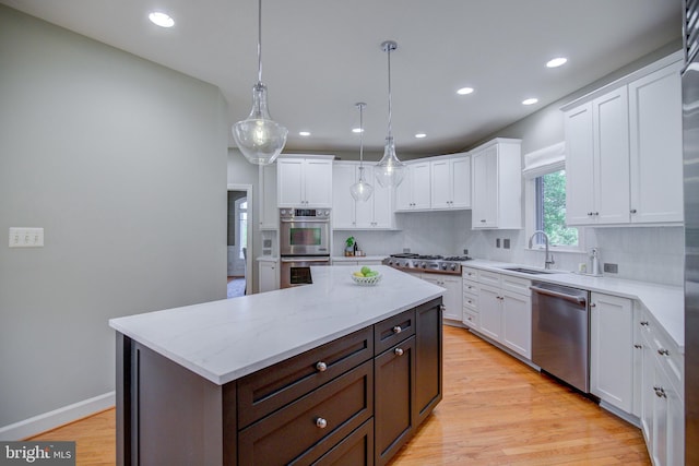 22966 Lois, Brambleton, VA 20148 - kitchen featuring stainless steel appliances, white cabinetry, a center island, light wood-style flooring, and recessed lighting