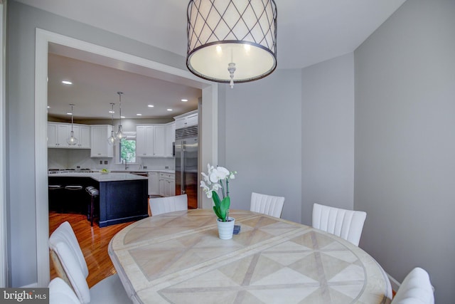 22966 Lois, Brambleton, VA 20148 - dining room with light wood-style flooring and recessed lighting