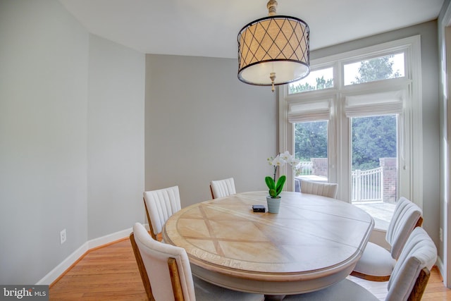 22966 Lois, Brambleton, VA 20148 - dining room with light wood-type flooring and baseboards