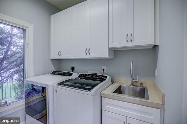 22966 Lois, Brambleton, VA 20148 - laundry room featuring washer and dryer and cabinet space