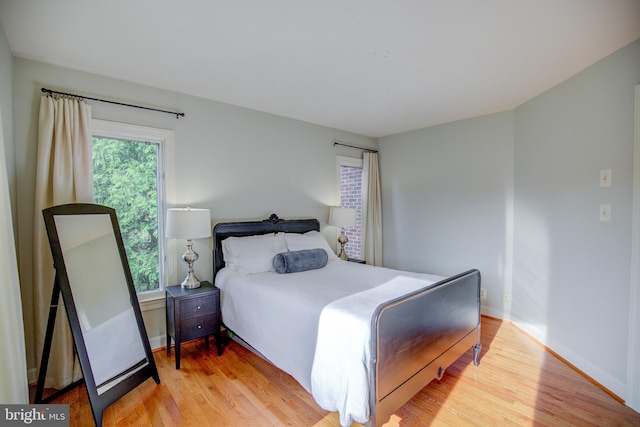 22966 Lois, Brambleton, VA 20148 - bedroom featuring wood finished floors and baseboards