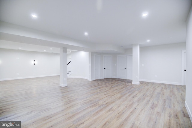 22966 Lois, Brambleton, VA 20148 - finished below grade area with light wood-type flooring, recessed lighting, and stairs