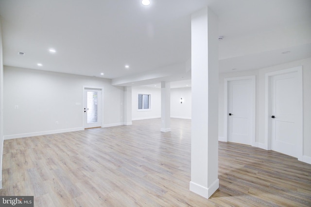 22966 Lois, Brambleton, VA 20148 - unfurnished living room with recessed lighting and light wood-type flooring