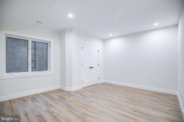 22966 Lois, Brambleton, VA 20148 - empty room with light wood-type flooring and recessed lighting