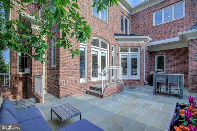 22966 Lois, Brambleton, VA 20148 - view of patio featuring french doors