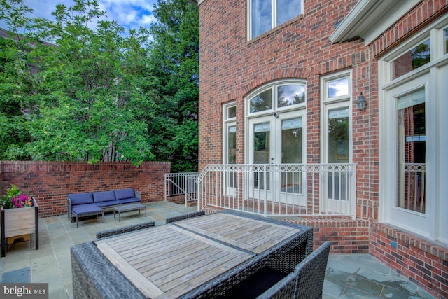 22966 Lois, Brambleton, VA 20148 - view of patio featuring outdoor lounge area and french doors
