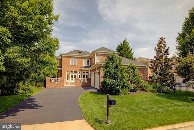 22966 Lois, Brambleton, VA 20148 - view of front of home with driveway, brick siding, and a garage