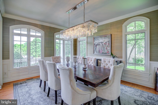 22966 Lois, Brambleton, VA 20148 - dining area with a chandelier, wallpapered walls, wainscoting, wood finished floors, and crown molding