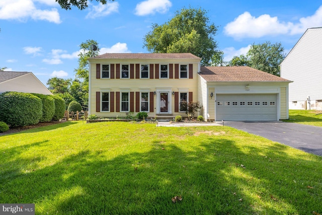 17105 Amity Dr, Derwood, MD 20855 - colonial house with driveway, a garage, and a front yard