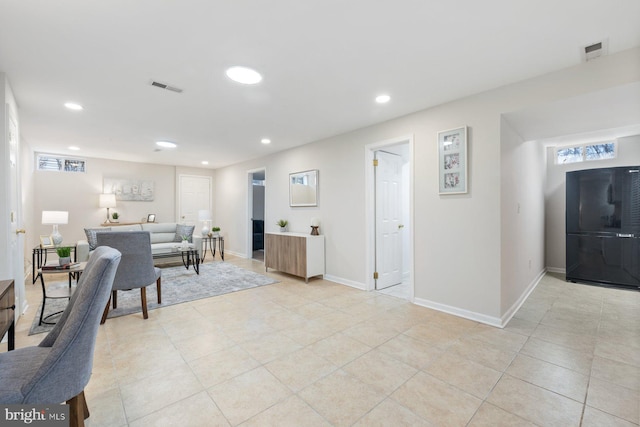 17105 Amity Dr, Derwood, MD 20855 - living room with recessed lighting and light tile patterned floors