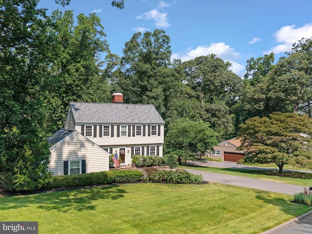994 Bayberry Dr, Arnold, MD 21012 - colonial home featuring a front lawn, a chimney, and a shingled roof