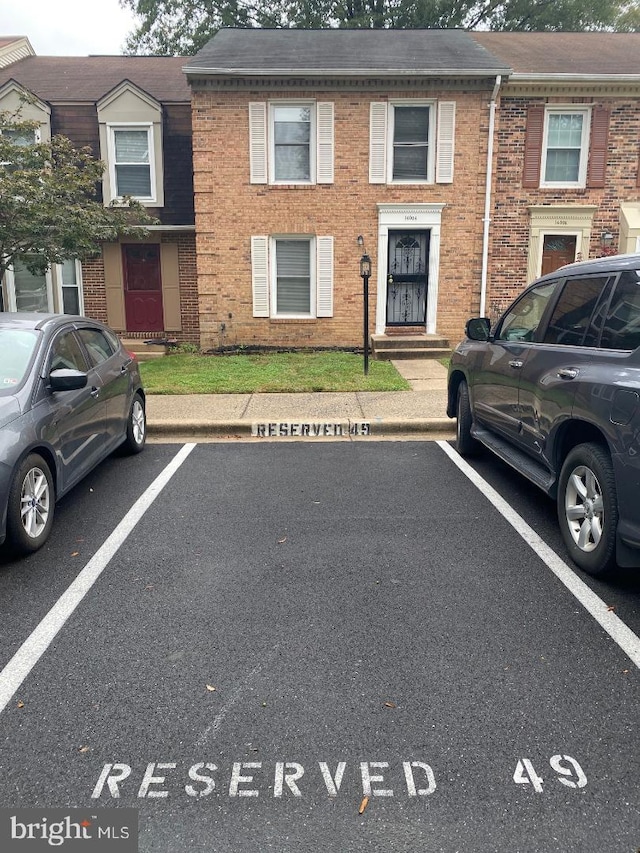 14004 Daleshire Way Unit 49, Burtonsville, MD 20866 - view of property featuring uncovered parking and brick siding