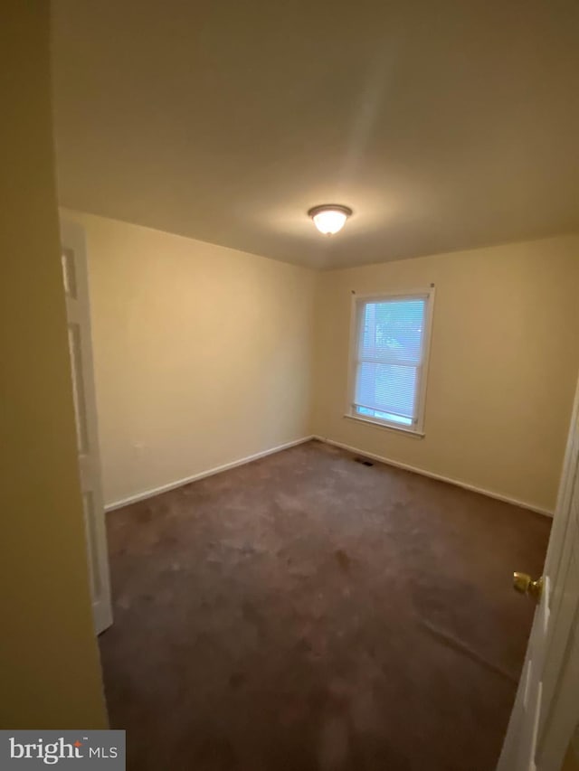 14004 Daleshire Way Unit 49, Burtonsville, MD 20866 - unfurnished room featuring baseboards and dark colored carpet