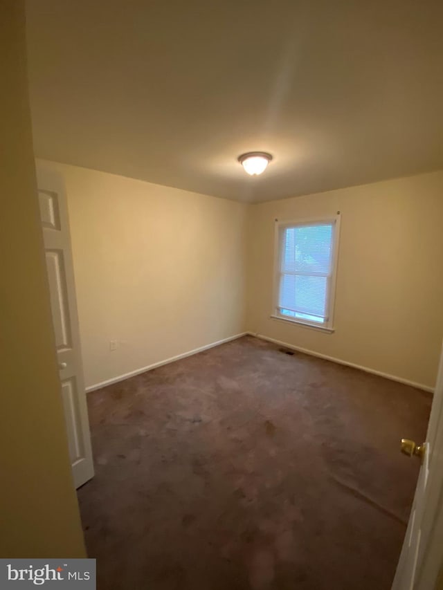 14004 Daleshire Way Unit 49, Burtonsville, MD 20866 - unfurnished room featuring baseboards and dark colored carpet