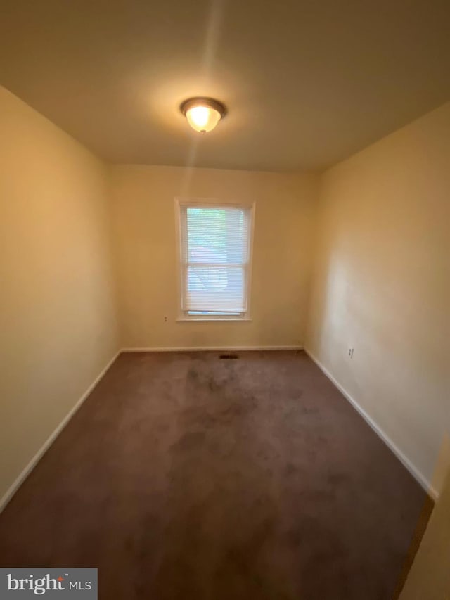 14004 Daleshire Way Unit 49, Burtonsville, MD 20866 - unfurnished room with baseboards and dark carpet