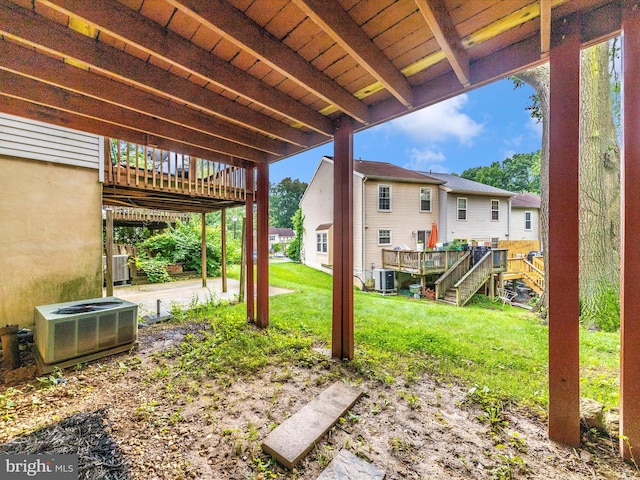 14004 Daleshire Way Unit 49, Burtonsville, MD 20866 - view of grassy yard featuring a wooden deck, a patio area, a residential view, and stairs