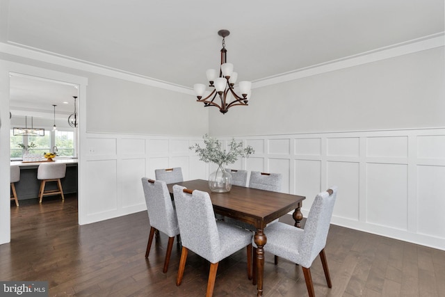 115 Saddle Ridge Ln, Fredericksburg, VA 22406 - dining room featuring a decorative wall, a chandelier, crown molding, dark wood-style flooring, and wainscoting