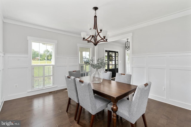 115 Saddle Ridge Ln, Fredericksburg, VA 22406 - dining space with a decorative wall, a chandelier, ornamental molding, plenty of natural light, and a wainscoted wall