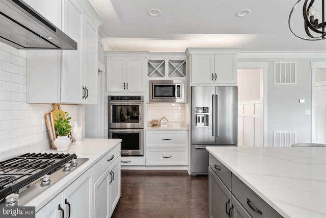 115 Saddle Ridge Ln, Fredericksburg, VA 22406 - kitchen with appliances with stainless steel finishes, wall chimney exhaust hood, decorative backsplash, light stone countertops, and recessed lighting