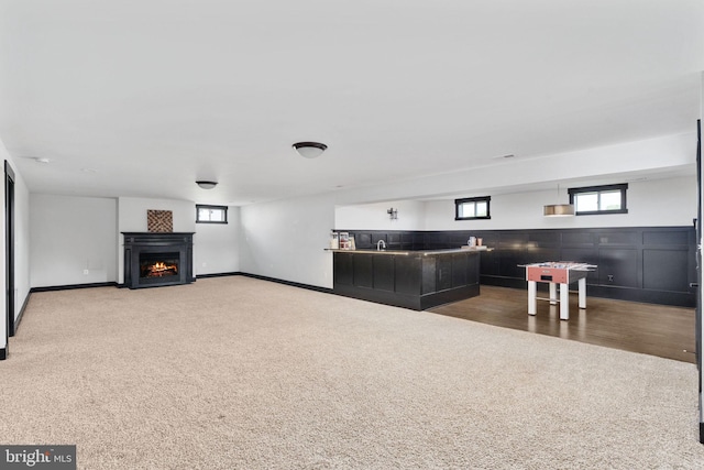 115 Saddle Ridge Ln, Fredericksburg, VA 22406 - living room with carpet floors, a lit fireplace, and wet bar