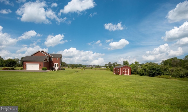 115 Saddle Ridge Ln, Fredericksburg, VA 22406 - view of grassy yard with a storage shed, asphalt driveway, and a garage