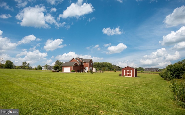 115 Saddle Ridge Ln, Fredericksburg, VA 22406 - view of grassy yard with a storage unit and an attached garage