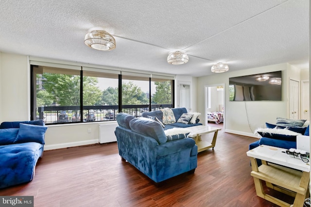 3701 S George Mason Dr Unit 205N, Falls Church, VA 22041 - living room featuring a textured ceiling and wood finished floors