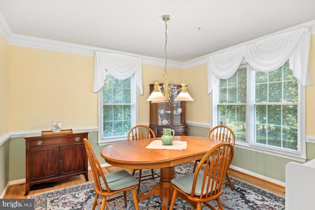10 Frantz Ct, Fredericksburg, VA 22405 - dining space featuring wood finished floors, healthy amount of natural light, a chandelier, and ornamental molding