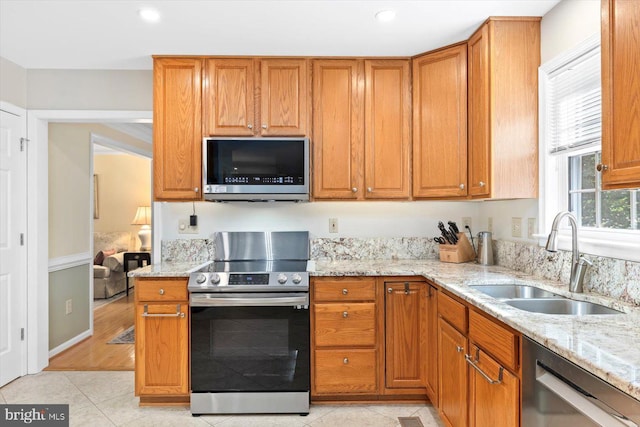 10 Frantz Ct, Fredericksburg, VA 22405 - kitchen with appliances with stainless steel finishes, light stone counters, light tile patterned flooring, and recessed lighting
