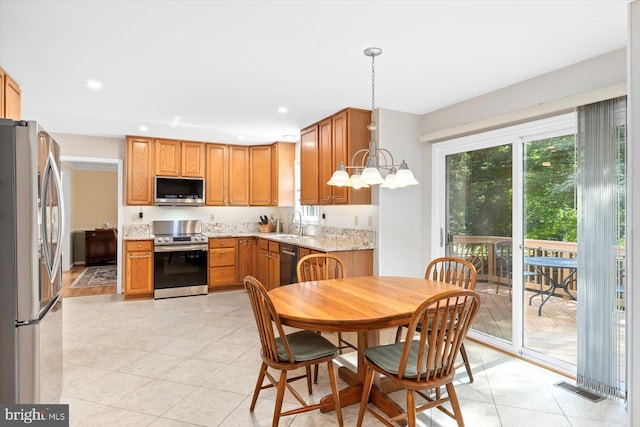 10 Frantz Ct, Fredericksburg, VA 22405 - kitchen with appliances with stainless steel finishes, hanging light fixtures, recessed lighting, light stone countertops, and light tile patterned floors