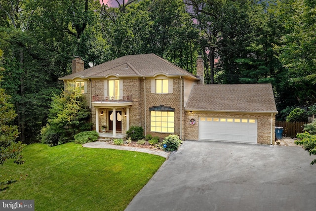 9100 Quarter Ct, Vienna, VA 22182 - view of front facade featuring a chimney, asphalt driveway, an attached garage, brick siding, and roof with shingles