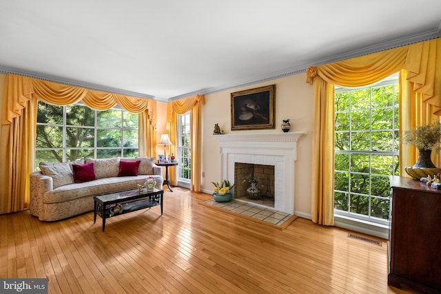 9100 Quarter Ct, Vienna, VA 22182 - living area with hardwood / wood-style flooring, crown molding, and a fireplace