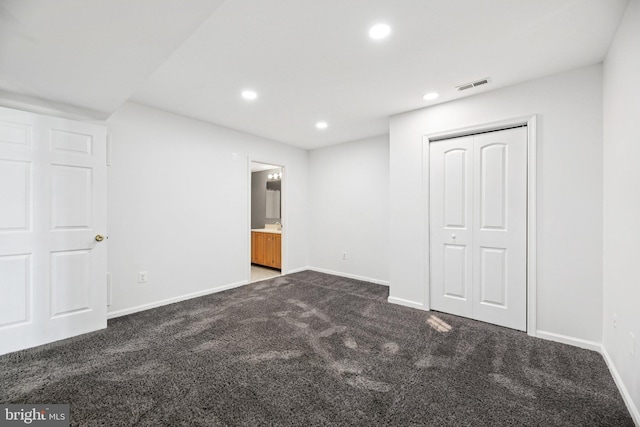 6432 Sedgwick St, Elkridge, MD 21075 - unfurnished bedroom featuring dark carpet, recessed lighting, a closet, and connected bathroom