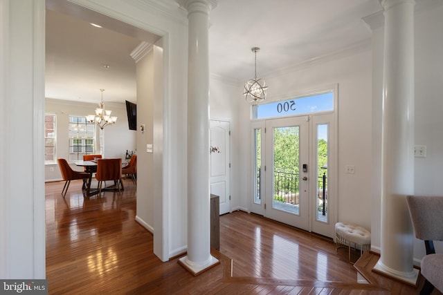 500 Overlook Park Drive 27, Oxon Hill, MD 20745 - foyer entrance featuring ornamental molding, decorative columns, a chandelier, and hardwood / wood-style flooring