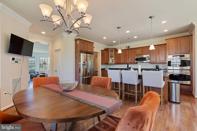 500 Overlook Park Drive 27, Oxon Hill, MD 20745 - dining room featuring recessed lighting, crown molding, light wood-type flooring, and a chandelier