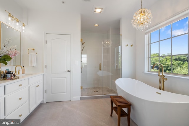 500 Overlook Park Drive 27, Oxon Hill, MD 20745 - bathroom featuring a chandelier, a stall shower, vanity, a soaking tub, and recessed lighting