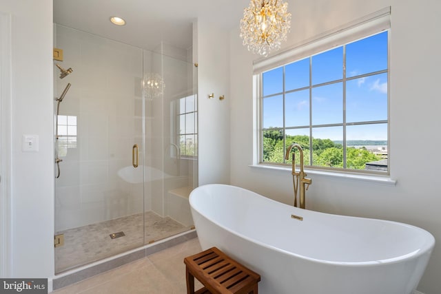 500 Overlook Park Drive 27, Oxon Hill, MD 20745 - bathroom featuring a chandelier, a stall shower, a freestanding bath, tile patterned flooring, and recessed lighting