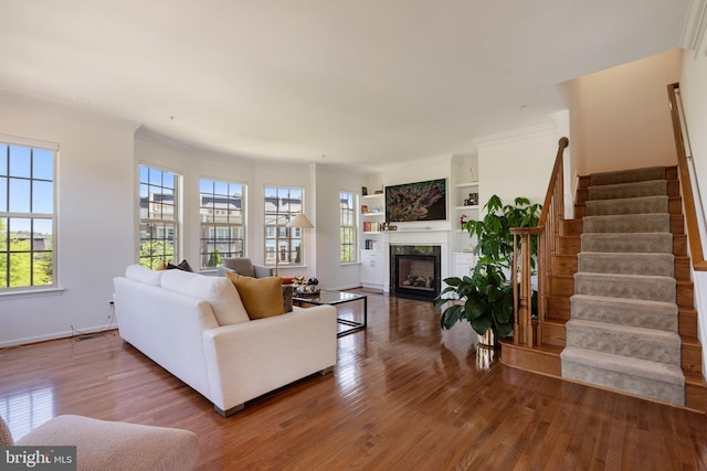 500 Overlook Park Drive 27, Oxon Hill, MD 20745 - living room featuring wood finished floors, stairway, a fireplace, and ornamental molding