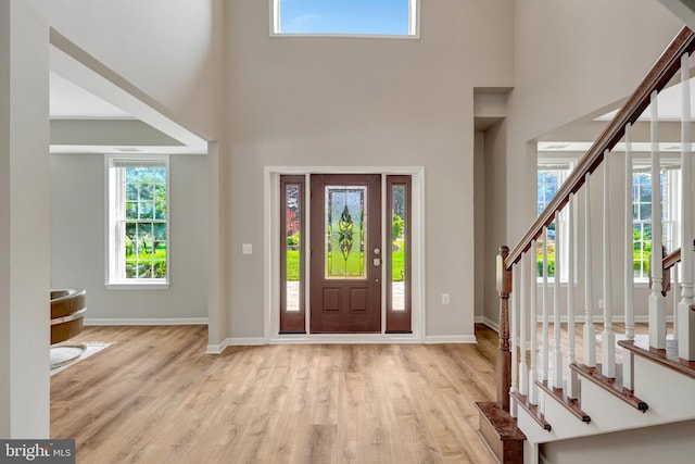 13336 Braddock Rd, Clifton, VA 20124 - entrance foyer with wood finished floors, stairway, and a towering ceiling