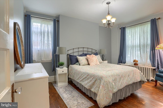 3124 Brisban St, Harrisburg, PA 17111 - bedroom featuring multiple windows, dark wood-type flooring, a chandelier, and radiator