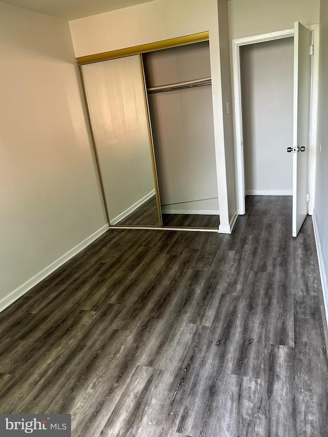 3205 Red Lion Rd, Philadelphia, PA 19114 - unfurnished bedroom with a closet and dark wood-style floors