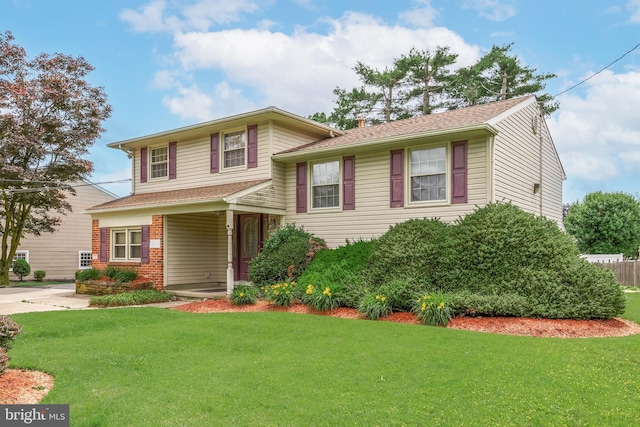 64 Warwick Rd, Stratford, NJ 08084 - tri-level home featuring a front lawn, a chimney, and brick siding