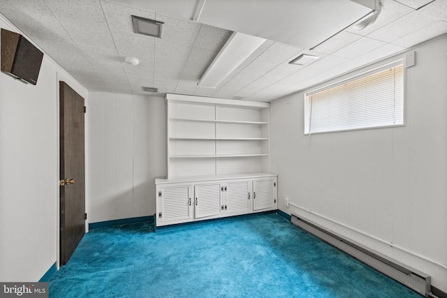 64 Warwick Rd, Stratford, NJ 08084 - basement featuring a baseboard heating unit and carpet