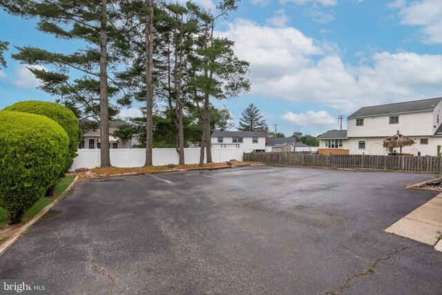 64 Warwick Rd, Stratford, NJ 08084 - uncovered parking lot featuring a residential view